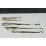 Three Silver Button Hooks and a Pair of Silver Tongs.