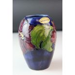 A Moorcroft vase decorated in the Anemone pattern paper label to under side.