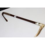 A 20th century Swaine riding crop with antler handle.