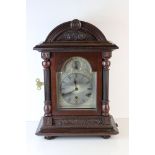An antique mahogany Bracket clock with three train movement and silvered engraved dial .