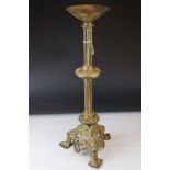 A large brass early 20th century alter candlestick in classical form.