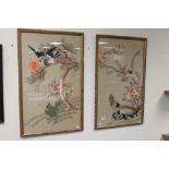 A pair of framed and glazed Oriental woolwork tapestry pictures of exotic birds.