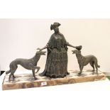 A large antique French spelter group of a women in a tricorn hat with two Saluki style dogs