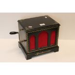 A Buskerette windup musical box