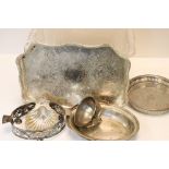 A box of various silver plated items to include candle sconces, cutlery ..etc.