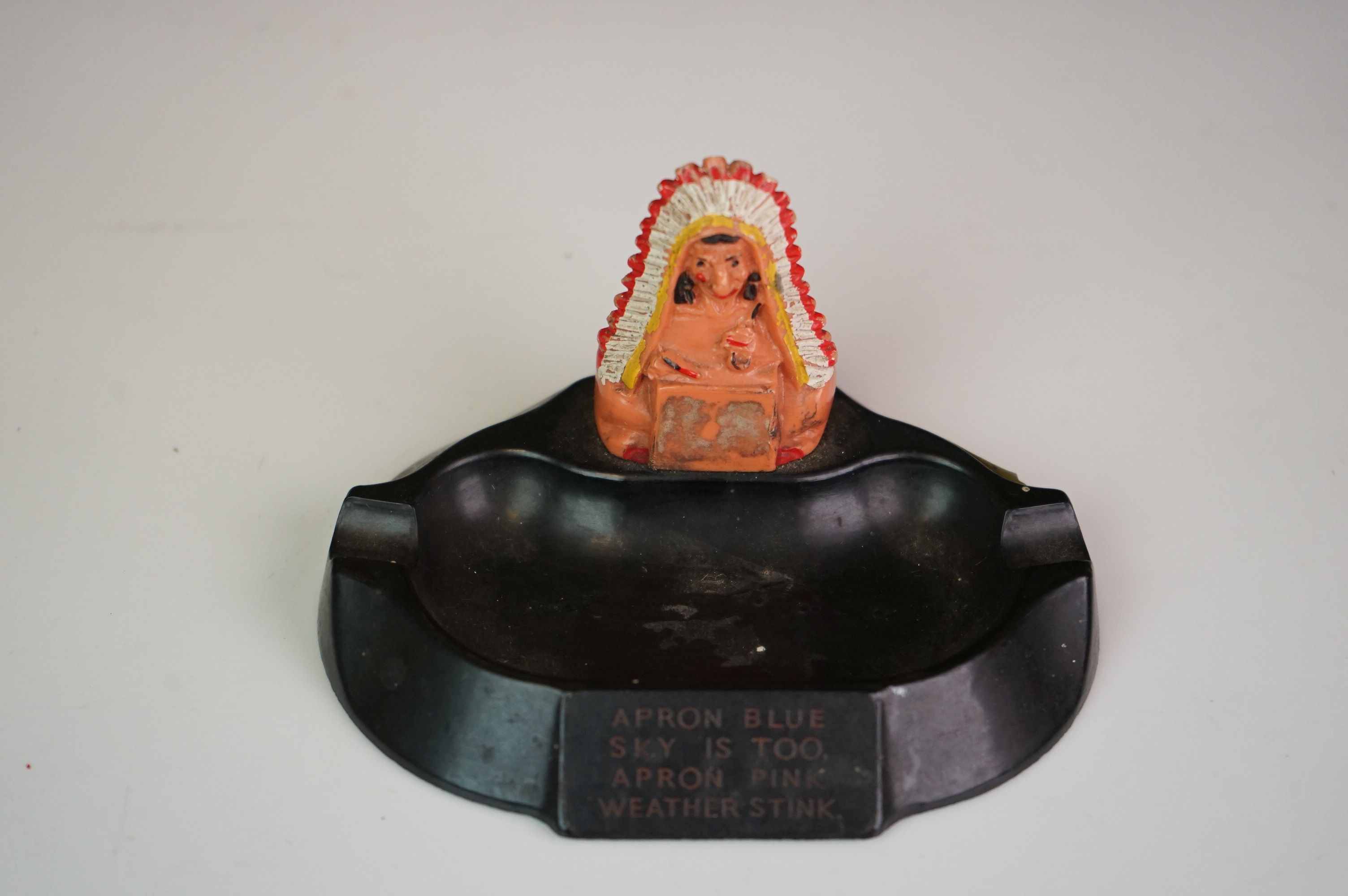 A Vogue Selco 1930's bakelite ashtray "Apron Blue" with a native American Indian.