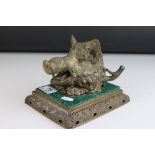 A mid 19th century inkwell in the form of a Wild Boars head mounted on a ceramic malachite style