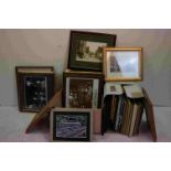 A large collection of framed and glazed pictures.