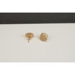 A pair of 9ct gold earrings.