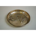 A silver pin tray with hounds head decoration, by John Rose, Birmingham, 1908, 13cm diameter