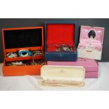 A box of contemporary and vintage costume jewellery contained within vintage jewellery boxes.