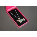 Silver sausage dog pendant necklace with ruby eye