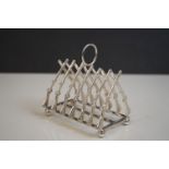 Silver plated rifle style toast rack on bun feet