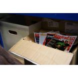 A large collection of modern Swindon Town football programmes contained within three boxes.