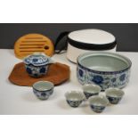 A Chinese four cup and tea pot set in original case.