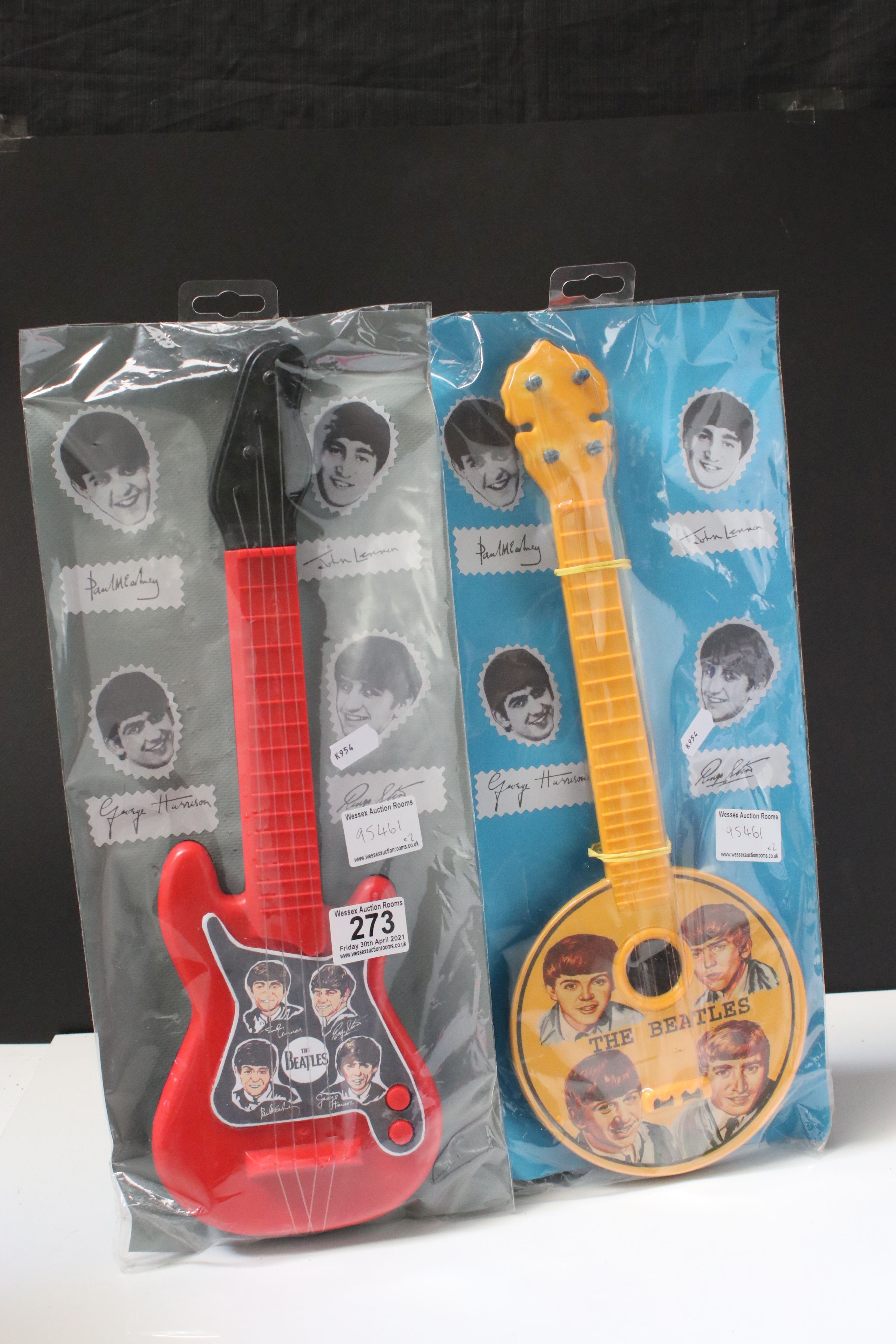 Music Toys - Two 1960s The Beatles plastic toy guitars with original cards within bags, excellent