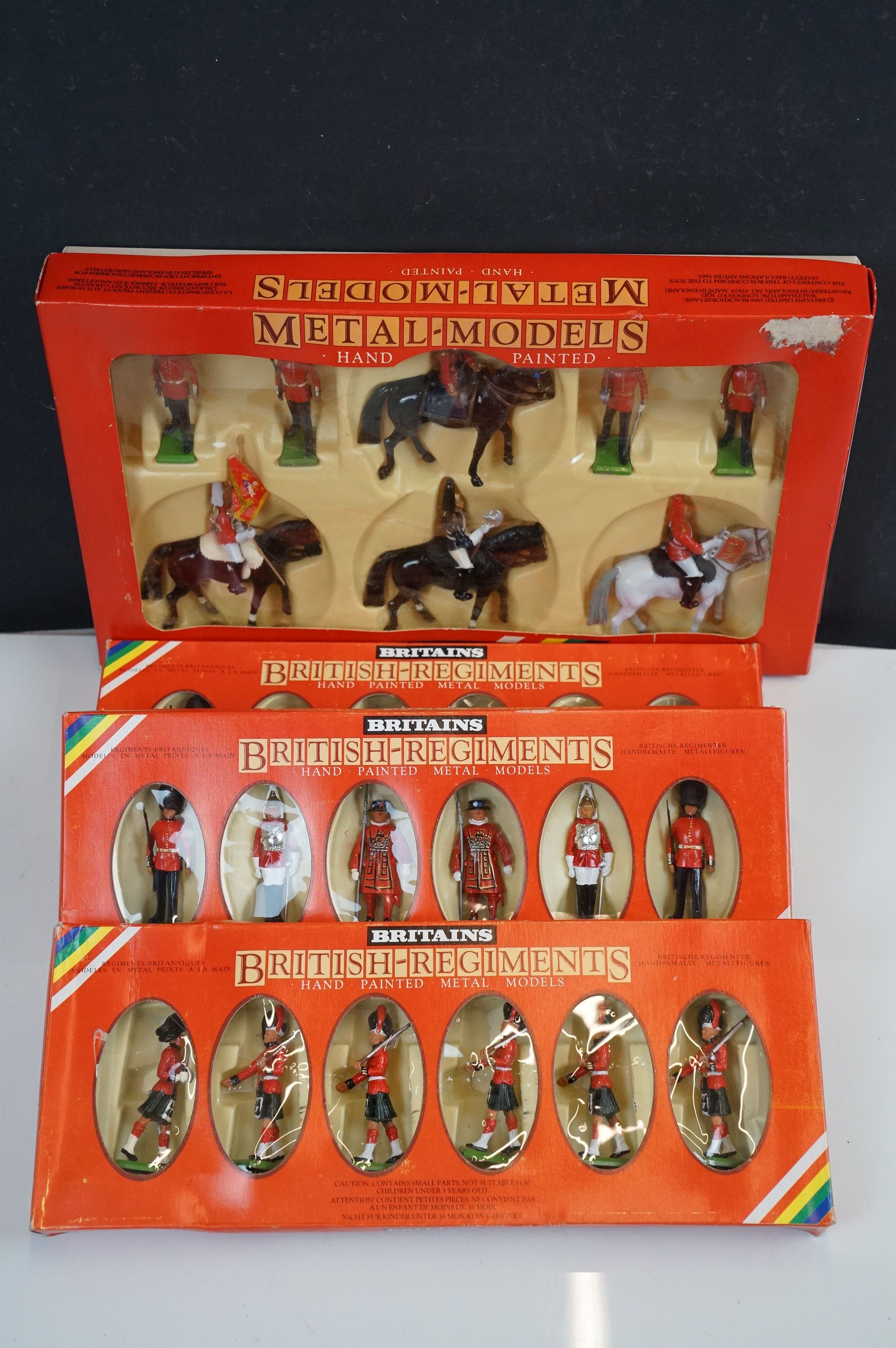 A collection of boxed Britains soldiers to include 7218 Queen Elizabethh II and Lifeguards, 7235
