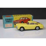 Boxed Corgi 218 Aston Martin DB4 diecast model in yellow with red interior, some paint chips, gd