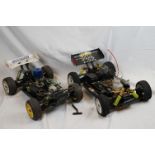A RC car buggy 1/8 scale Protech Ultrex Evo Nitro 0.21 4WD engine together with a CEN GSR 5.0