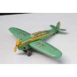 Wells O London wind up tin plate model plane '301' in green with yellow, vg condition with propeller