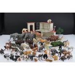 A box containing a quantity of Britains Zoo animals together with scratch built wooden zoo