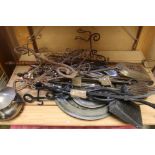 A collection of fire side companion tools together with a group of pewter plates.