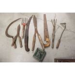 A small group of vintage gardening tools to include shears and saws.