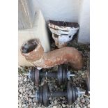 Cast iron items - an Edwardian rain water hopper, a swan neck soil vent pipe & a pair of dumbells (