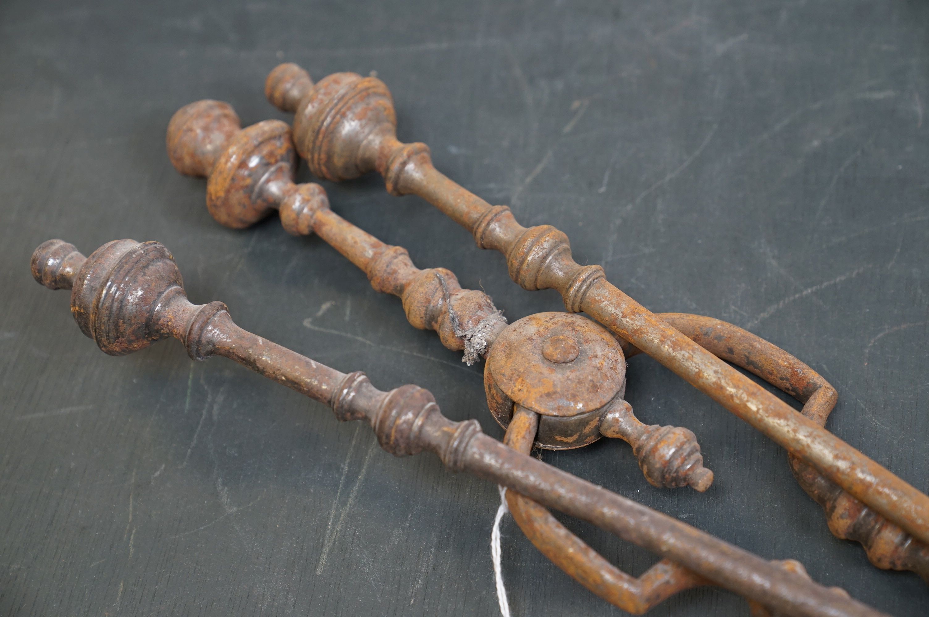 A vintage iron three piece fire tool companion set comprising of shovel, poker and tongs. - Image 3 of 5