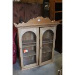 Late 19th / Early 20th century Pine Hanging Cabinet with two glazed doors opening to adjustable