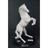 A Royal Doulton "Spirit of the Wild" blanc de chine figure of a horse.