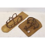 Two vintage iron mounted horse tack racks