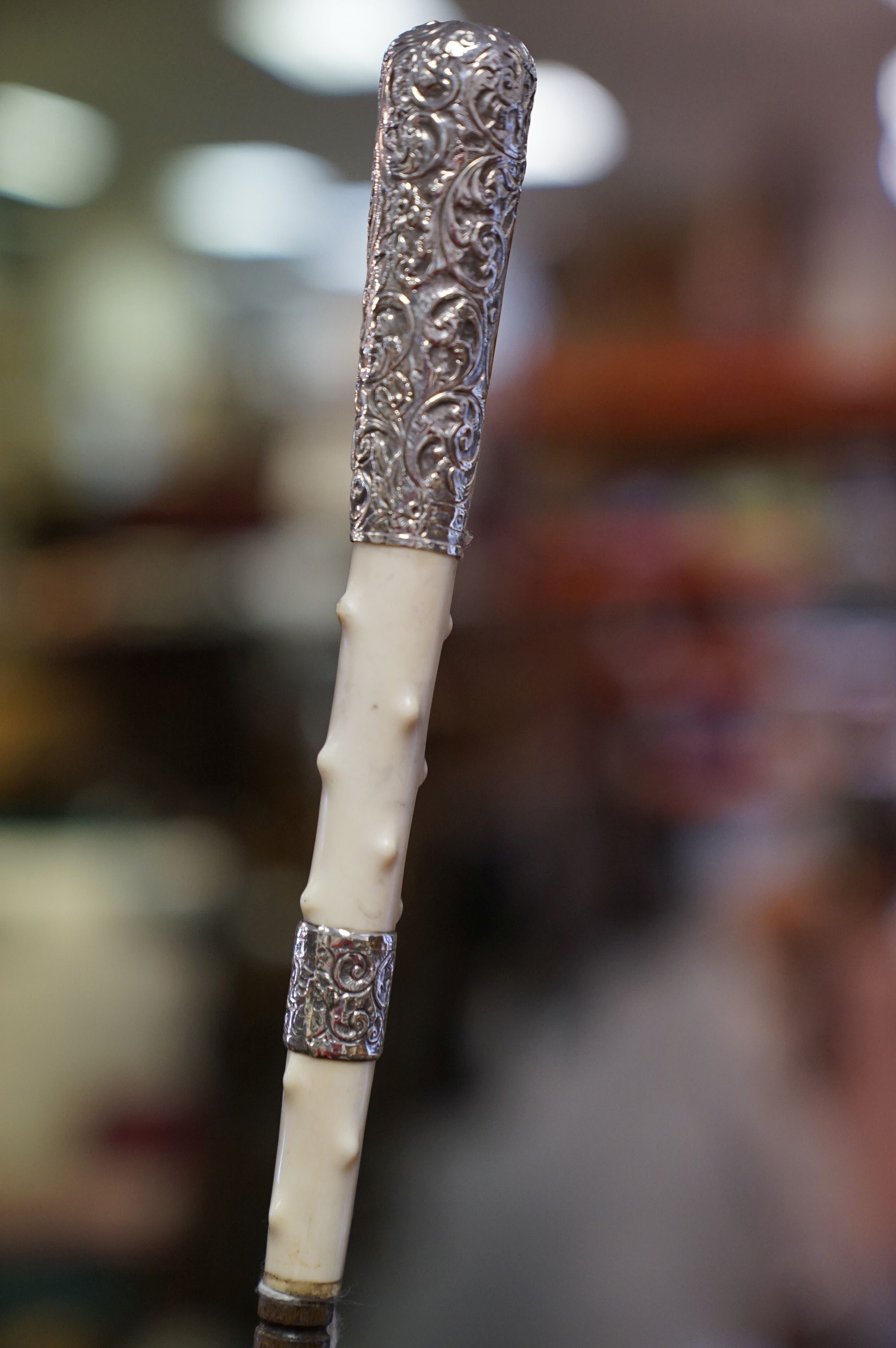 An antique walking cane with silver and ivory knobbled handle and later brass ferrules. - Image 2 of 4