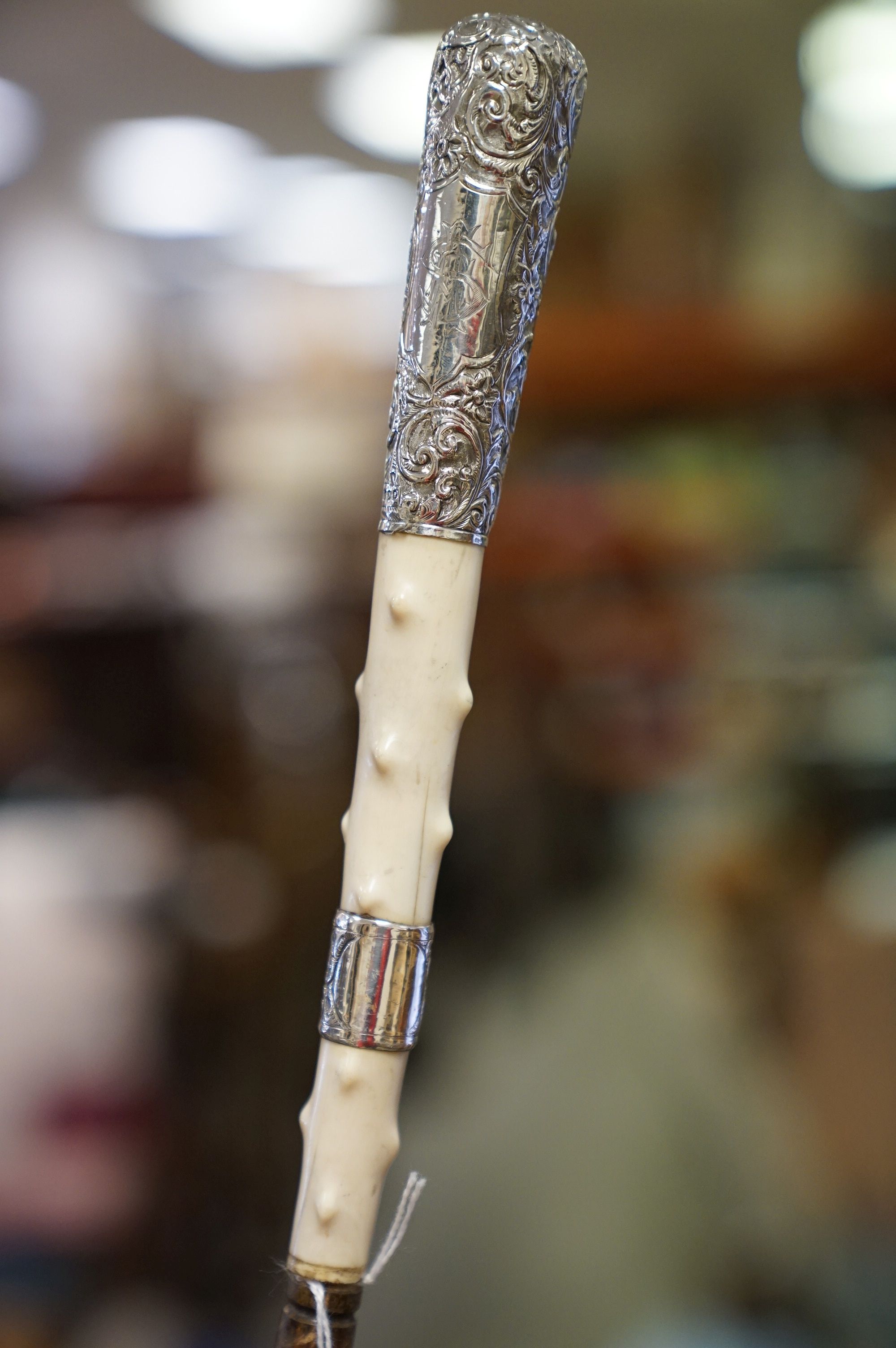 An antique walking cane with silver and ivory knobbled handle and later brass ferrules. - Image 3 of 4