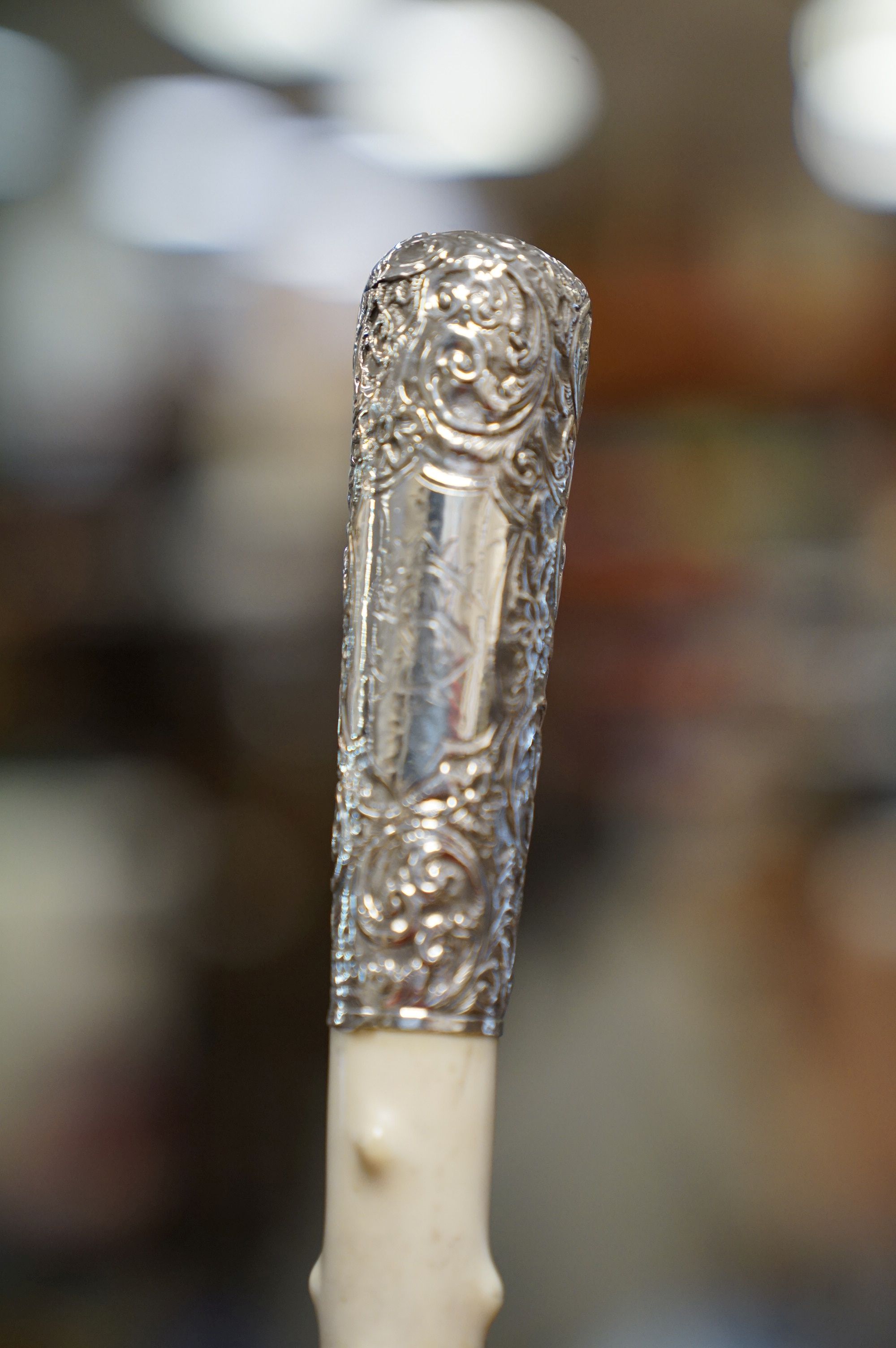 An antique walking cane with silver and ivory knobbled handle and later brass ferrules. - Image 4 of 4