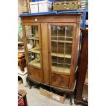 Edwardian Bow Fronted Mahogany Inlaid Display Cabinet with Two Leaded Glass Doors, raised on