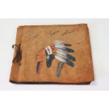 Leather / Suede Album painted with a Native American in Headdress containing cigarette cards