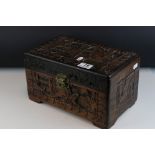 A set of three oriental carved wooden graduated boxes.