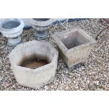 Two large reconstituted stone garden planters.