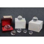 Group of seven Swarovski Crystal Sport paperweights, some in original boxes