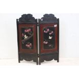 Japanese Ebonised and Lacquered Two Fold Screen decorated with birds and flowers, each screen