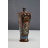 An oriental cloisonne vase with floral decoration, stands approx 15cm tall.