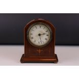 An early 20th century mahogany dome topped mantle clock with string inlay decoration.