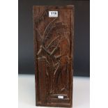 A carved hardwood panel of a woodsman. measures approx 47cm in height.