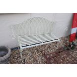 A contemporary white metal outdoor bench seat, measures approx 127cm in width.