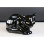 French Emaux de Longwy Pottery Black Cat, stamped to base ' Faienceries de Longwy ', 24cms long