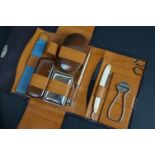 A vintage gents fitted manicure set to include cut throat razor.