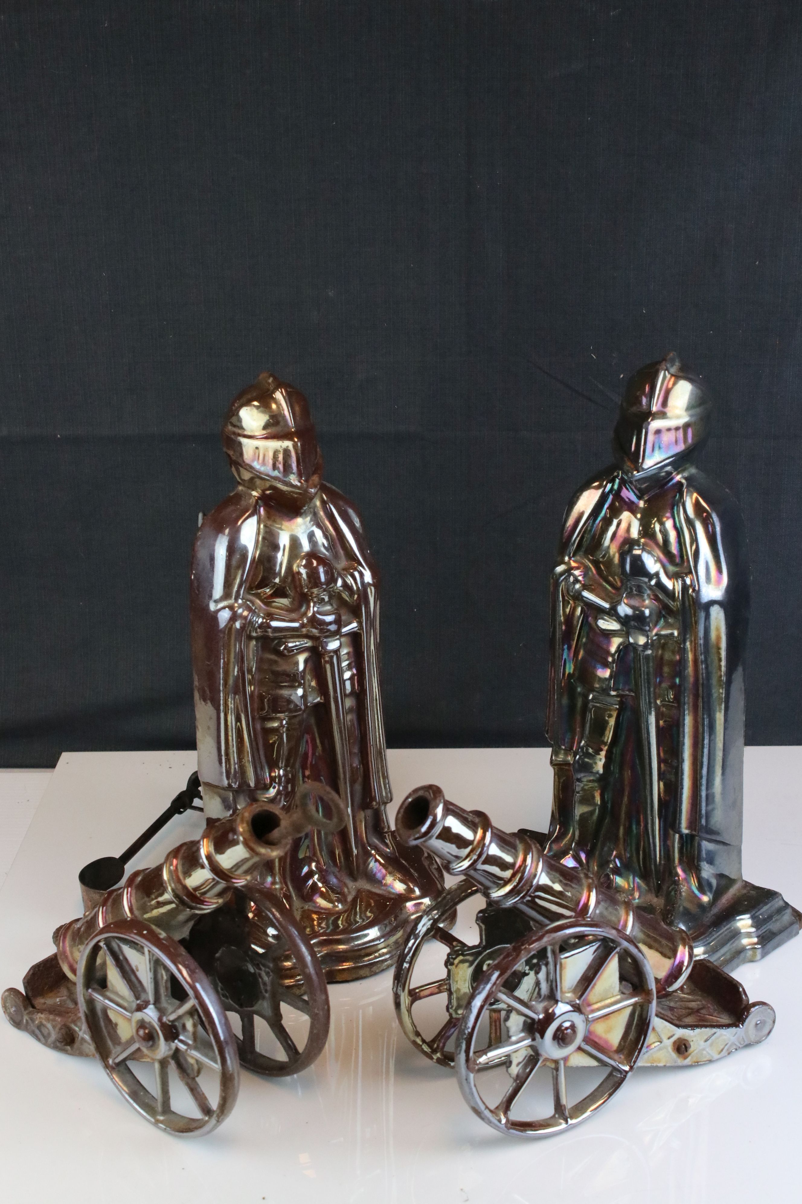 A pair of vintage Knight fireside companion sets together with two canons.