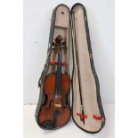 A vintage cased violin.