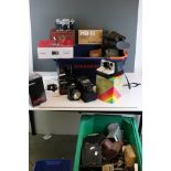 A large collection of cameras, lenses and accessories to include Canon, Vivitar and Meyer examples.